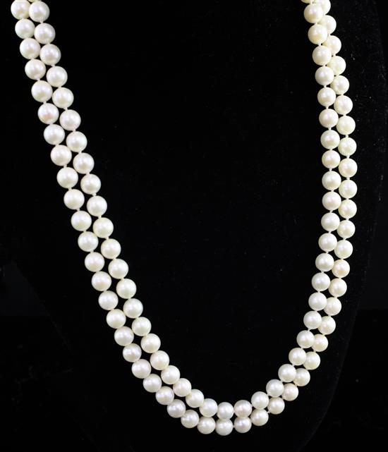 A double strand cultured pearl necklace with stylish 14ct gold, ruby, sapphire and diamond set clasp, 18in.